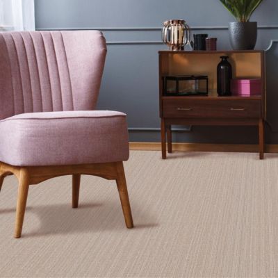 textured beige carpets in a stylish living room with pink chair